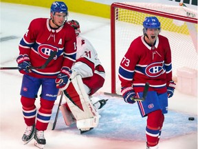 Canadiens' Tyler Toffoli celebrates his goal against Carolina Hurricanes goalie Frederik Andersen last month while teammate Nick Suzuki looked on. It was one of only three goals Toffoli has scored this season.