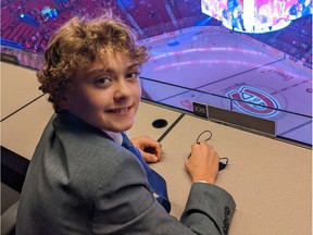 Ottawa's Zander Zatylny, 12, at the Bell Centre press box in Montreal on Saturday, Nov. 6, 2021. Zander, who has a rare heart disease and has started a website and podcast to help raise awareness for children's hospitals across the country, is making a cross-Canada tour of NHL arenas.