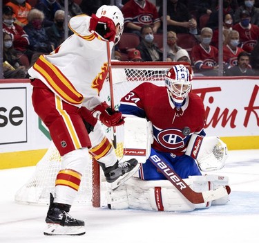 Calgary Flames left wing Matthew Tkachuk is stopped by Montreal Canadiens goaltender Jake Allen during 2nd-period NHL action in Montreal on Thursday, Nov. 11, 2021.