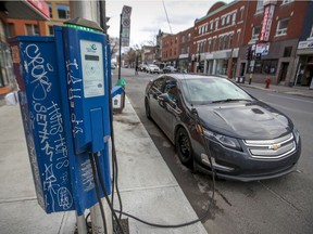 An electric car hooked up to a curbside charging station in Montreal.