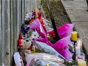 Flowers, candles and a hockey stick mark the site of the shooting death of 16-year old Thomas Trudel in the St-Michel district of Montreal.