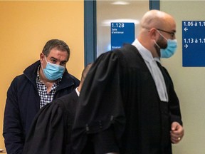 Paul Zaidan, who faces kidnapping and extortion charges, is seen leaving an interview room at the Laval courthouse on Tuesday.