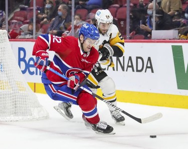 Montreal Canadiens' Jonathan Drouin protects the puck from Pittsburgh Penguins' Kris Letang during third period in Montreal Thursday, Nov. 18, 2021.