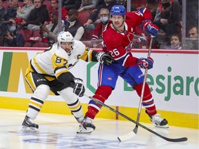 Canadiens' Jeff Petry is pressured by Pittsburgh Penguins' Sidney Crosby in Montreal on Nov. 18, 2021.