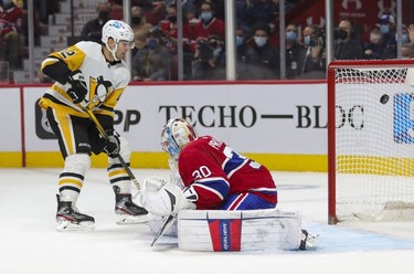 Pittsburgh Penguins' Zach Aston-Reeves shoots the puck past Montreal Canadiens goalie Cayden Primeau for his team's 4th goal during second period in Montreal Thursday, Nov. 18, 2021.