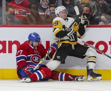 Montreal Canadiens' Brett Kulak drags down Pittsburgh Penguins' Jake Guentzel during second period in Montreal Thursday, Nov. 18, 2021.