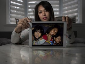 Lalaine Canillo hasn't seen her three daughters (in the photo, from the left: Alexxianie Pierre, Alexa Madelaine and Alexandrea Camerron) since 2019.