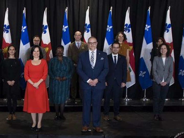  Mayor Valérie Plante, centre in red dress, with her newly-unveiled executive committee in Montreal at the Marché Bonsecours on Nov. 24, 2021.