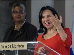 Mayor Valérie Plante speaks at a press conference with chairperson of the city's executive committee, Dominique Ollivier listening after she unveiled new executive committee in Montreal at the Marché Bonsecours.