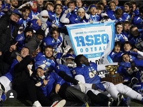John Abbott College players celebrate after winning the Bol D'Or football championship.