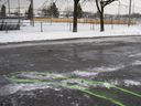 Police markings describe an area where bloodstains were found at the scene of a stabbing at the Marc-Aurèle-Fortin park in Laval on January 2, 2020.