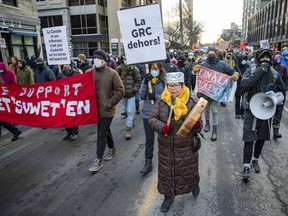 Wet'suwet'en elder Marlene Hale leads a demonstration showing support for British Columbia's Wet'suwet'en people, who are fighting the construction of a natural gas pipeline by Coastal Gas Linkin, in Montreal on Saturday, Nov. 27, 2021.