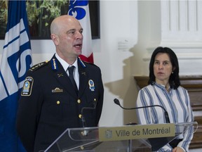 Mayor Valérie Plante listens as SPVM deputy chief Vincent Richer speaks at a news conference in Montreal Monday, November 29, 2021 to announce a forum on armed violence.