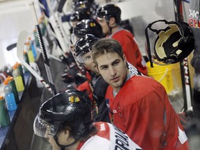 Former Chicago Blackhawks forward Kyle Beach on the bench in 2013 at a practice facility.