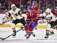 Canadiens' Jake Evans skates the puck against Alec Martinez (23) of the Vegas Golden Knights during the second period at the Bell Centre on Saturday, Nov. 6, 2021, in Montreal.