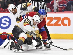 Jake Leschyshyn of the Vegas Golden Knights and Michael Pezzetta of the Montreal Canadiens battle during the second period in Montreal on Nov. 6, 2021.
