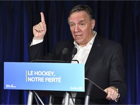 Quebec Premier François Legault, makes an announcement to develop the game of hockey within the province of Quebec and to increase the number of Quebecers in the NHL, prior to the game between the Montreal Canadiens and the Pittsburgh Penguins at the Bell Centre on Nov. 18, 2021, in Montreal.