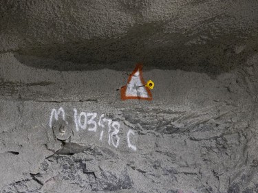 A surveyor's prism marks are seen at the REM tunnel, at about 72 metres below the surface at the Édouard-Montpetit station on Wednesday, Nov. 24, 2021.