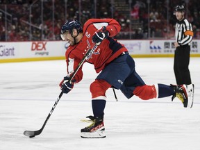 Alex Ovechkin of the Washington Capitals takes a slap shot against the Pittsburgh Penguins during the second period at Capital One Arena on Nov. 14, 2021, in Washington.