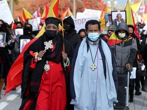 Hundreds of protesters march down Sussex Drive Thursday on their way to Parliament Hill to stand in solidarity with the Tigrayan community.