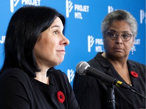 Valérie Plante, left, speaks as Dominique Ollivier looks on, during a press conference, in Montreal, on Tuesday, Nov. 2, 2021.