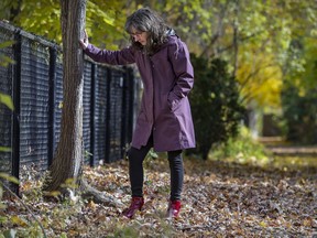 Dr. Anne Bhéreur rests to catch her breath while going for a slow walk in the lane behind her home. She suffers from long COVID, and on a good day, feels about 10 per cent of her former healthy and energetic self.