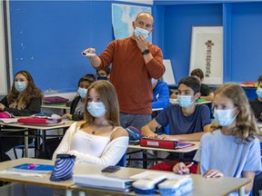 Andrew Hannah adjusts his mask while teaching Secondary 2 math at Beaconsfield High School on Thursday September 9, 2021.