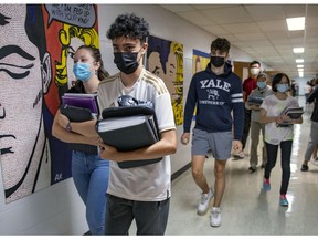 Students wear masks in the halls at Beaconsfield Hich School in Beaconsfield, west of Montreal Thursday September 9, 2021.