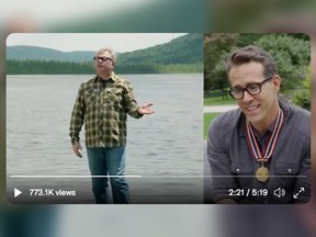 Ryan Reynolds, right, watching singer Steven Page's musical video tribute in honour of Reynolds' Governor General's Award.