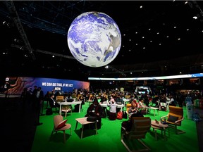 Delegates attend the the COP26 UN Climate Summit in Glasgow. Reliance on fossil fuels harms billions of vulnerable people living on the front lines of climate change, Leehi Yona says.