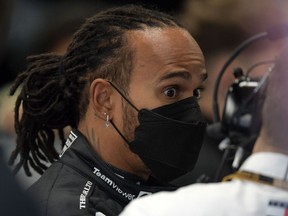 Mercedes' British driver Lewis Hamilton is pictured at the team's garage in pit lane during the free practice second session at the Autodromo Jose Carlos Pace, or Interlagos racetrack, in Sao Paulo, on November 13, 2021, ahead of Brazil's Formula One Sao Paulo Grand Prix. - Brazil will hold its F1 Sao Paulo Grand Prix on November 14.