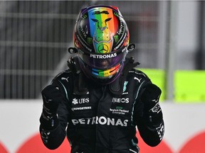 Mercedes' British driver Lewis Hamilton celebrates after the qualifying session ahead of the Qatari Formula One Grand Prix at the Losail International Circuit, on the outskirts of the capital city of Doha, on November 20, 2021.