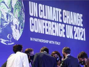 Delegates talk during the UN Climate Change Conference (COP26) in Glasgow, Scotland, on Saturday, Nov. 13, 2021.