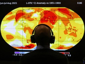 A delegate looks at a screen during the UN Climate Change Conference (COP26) in Glasgow, Scotland, Britain, November 8, 2021.