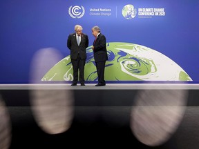 British Prime Minister Boris Johnson and United Nations Secretary General Antonio Guterres in conversation during arrivals for the UN Climate Change Conference (COP26) in Glasgow, Scotland on Monday.