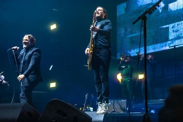 Karl Tremblay, left, Jérôme Dupras of the Quebec band Les Cowboys Fringants at the Bell Centre in Montreal on Thursday, Nov. 25, 2021.