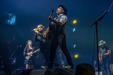 Marie-Annick Lépine, Karl Tremblay and Jean-François Pauzé, left to right, of the Quebec band Les Cowboys Fringants  at the Bell Centre in Montreal on Thursday, Nov. 25, 2021.