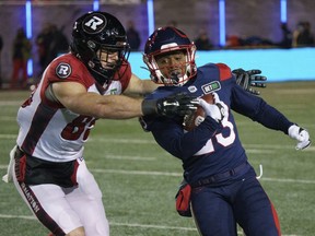 Alouettes running-back Martese Jackson tries to get past Ottawa Redblacks wide-receiver Kenny Stafford on a kick return during  in Montreal on, Nov. 19, 2021.