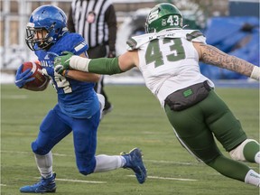 University of Saskatchewan Huskies' Nick Wiebe (43) reaches for University of Montreal Carabins' Alexis Boulangé as he carries the ball during the Uteck Bowl in Montreal on Saturday, Nov. 27, 2021.