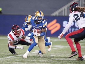 Winnipeg Blue Bombers wide receiver Janarion Grant (80) evades a tackle by Montreal Alouettes defensive back Adarius Pickett (6) during the 3rd quarter during a Canadian football League game at IG Field. Winnipeg Blue Bombers defeat Montreal Alouettes 31-21.