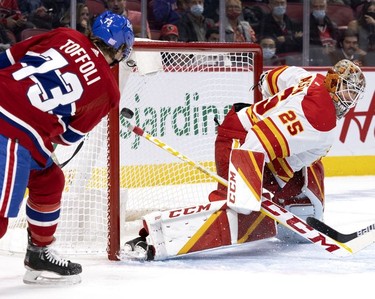 Montreal Canadiens right wing Tyler Toffoli watches as Montreal Canadiens defenseman Ben Chiarot's shot sails past Calgary Flames goaltender Jacob Markstrom in first-period action on Thursday, Nov. 11, 2021.