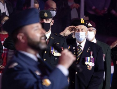 Montreal Canadiens honour Canadian veterans during the national anthem before game against the Calgary Flames  in Montreal on Thursday, Nov. 11, 2021.