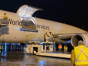 A UPS plane with thousands of pediatric doses is unloaded in Hamilton on Nov. 21, 2021.
