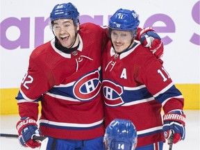 Canadiens' Brendan Gallagher (11) celebrates with teammate Jonathan Drouin (92) after scoring against the Nashville Predators in Montreal on Saturday, Nov. 20, 2021.