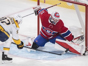 Montreal Canadiens goaltender Sam Montembeault makes a save against Nashville Predators' Ryan Johansen during first period in Montreal on Nov. 20, 2021.