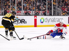 Canadiens defenceman Jeff Petry (26) defends Boston Bruins right wing David Pastrnak (88) during the second period at TD Garden in Boston on Sunday, Nov. 14, 2021.
