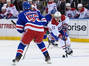 Canadiens right wing Brendan Gallagher (11) skates across the blue line defended by New York Rangers defenceman Ryan Lindgren (55) during the first period at Madison Square Garden in New York on Tuesday, Nov. 16, 2021.