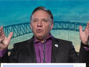 Quebec Premier François Legault  gestures to the delegates after his speech at the end of a party meeting marking the 10th anniversary of the Coalition Avenir Québec on Sunday, Nov. 14, 2021 in Trois-Rivières.