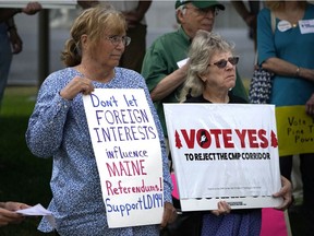 Protesters showed their support this summer for overriding Gov. Janet Mills' veto of a bill that would have banned entities owned by foreign governments from influencing Maine elections. The bill was inspired by Hydro-Québec's vast spending to convince Maine voters to defeat referendums that would sink Central Maine Power's controversial transmission project.