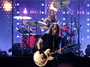 Dave Grohl and Taylor Hawkins of Foo Fighters perform after the band was inducted into the Rock and Roll Hall of Fame, in Cleveland, Ohio, on October 30, 2021.